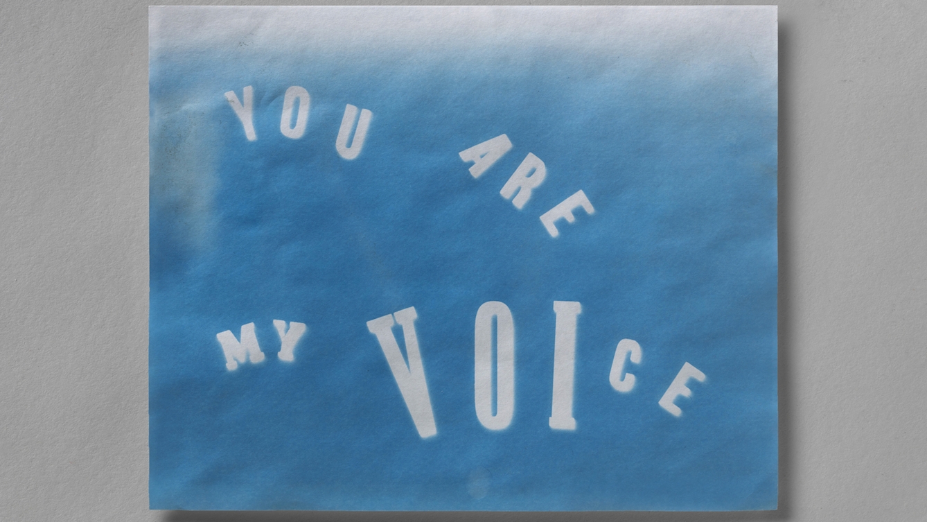 A blue and white printed artwork which says "You are my voice".