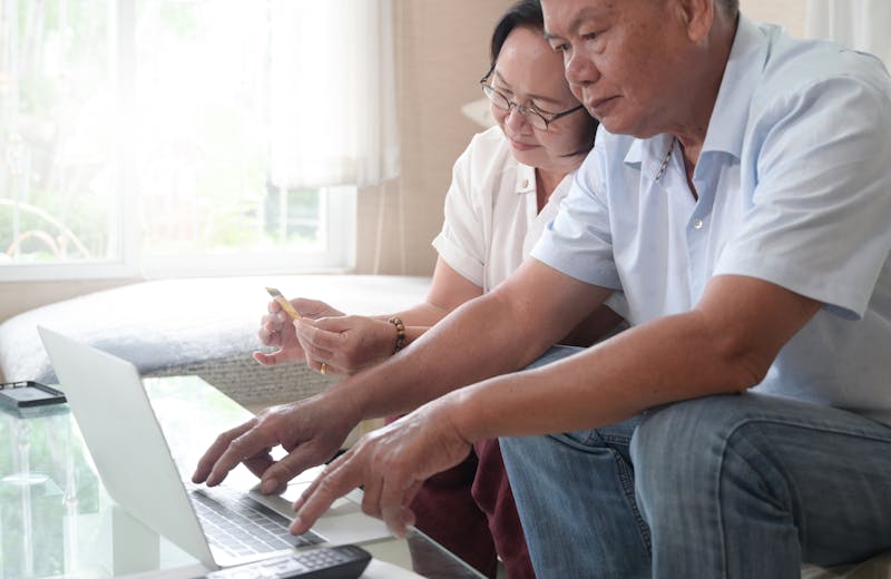 Older couple using laptop