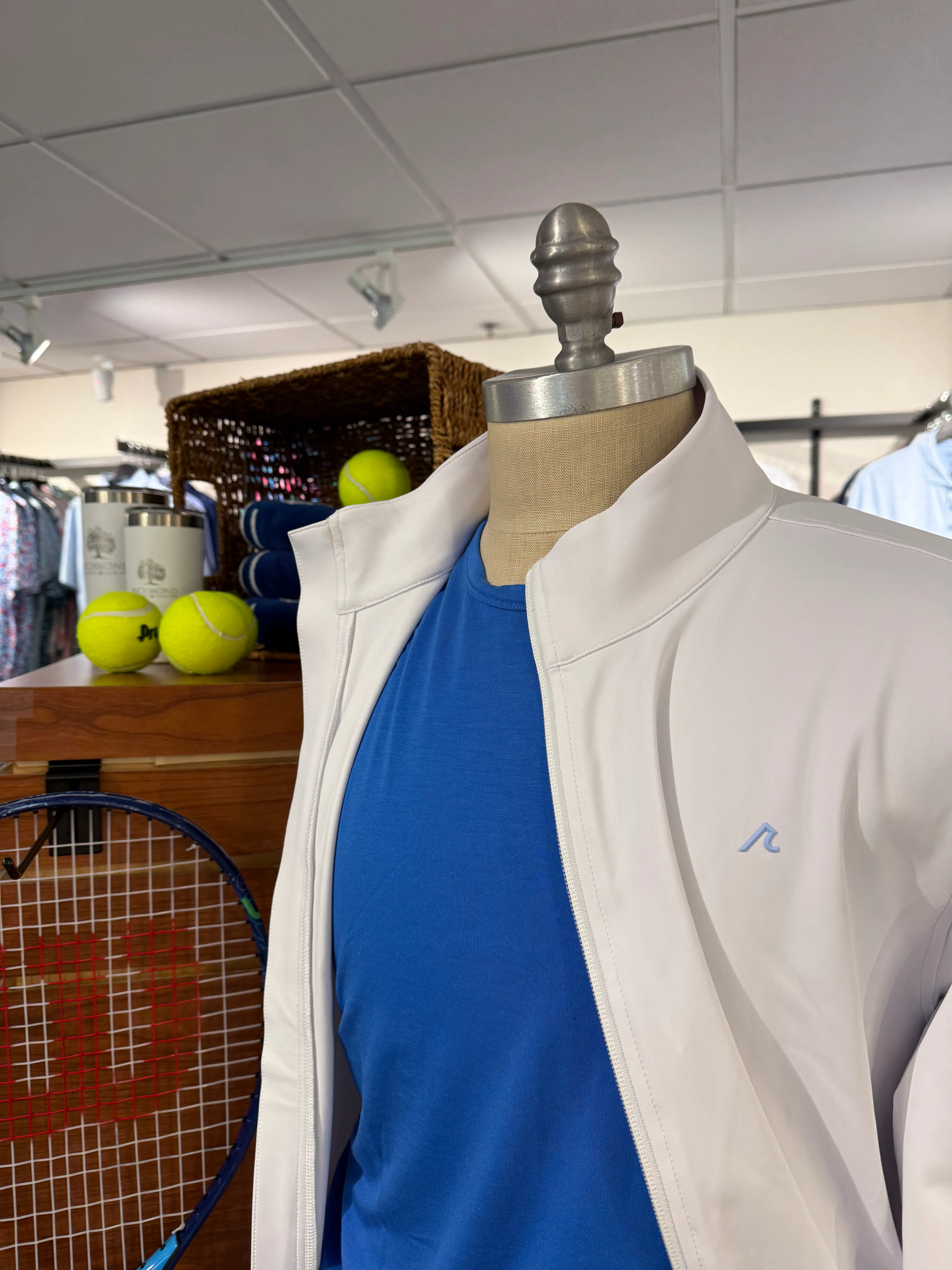 Close up shot zip up sweatshirt on mannequin with tennis racket