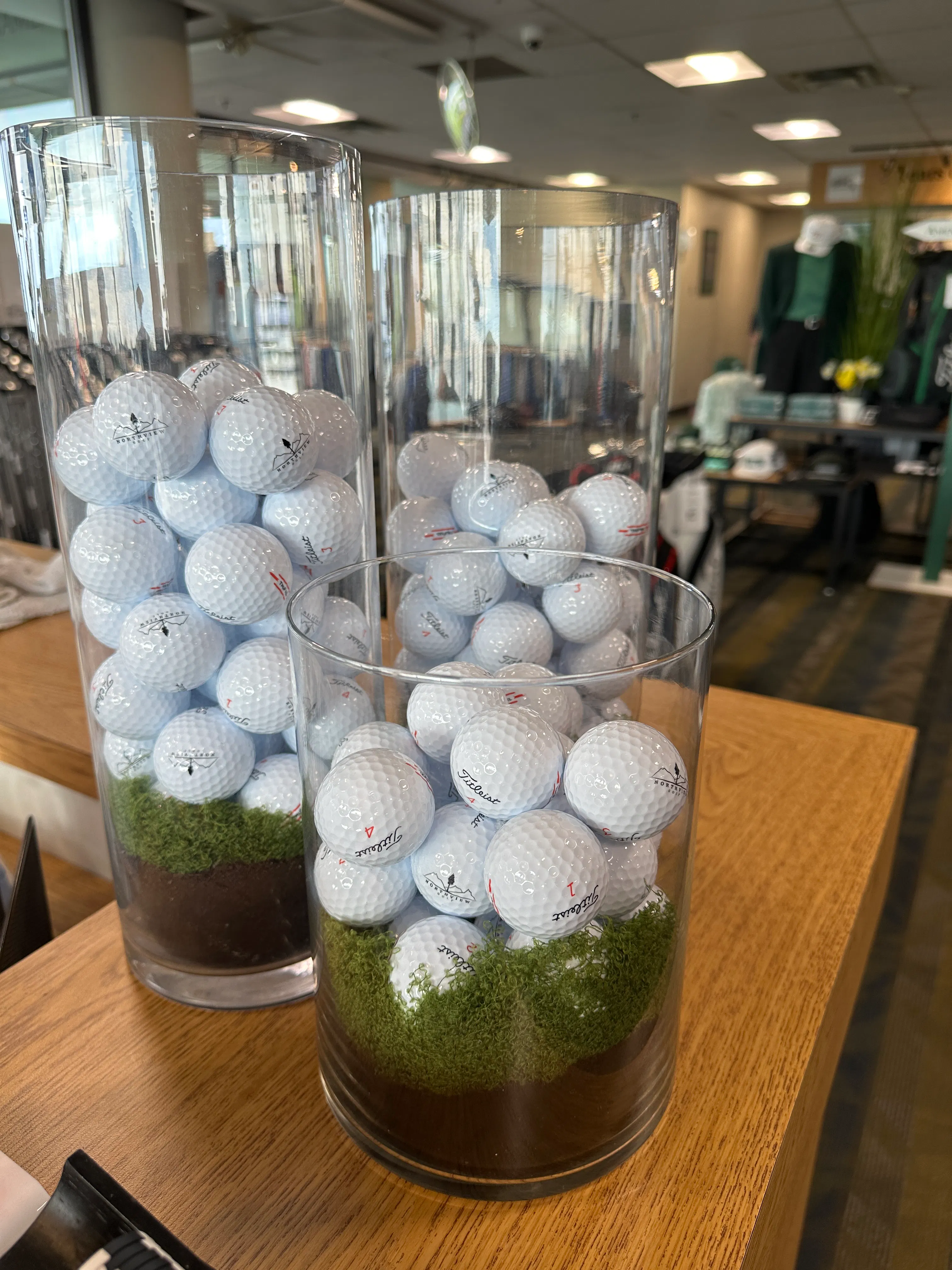 Creative golf ball display in glass vases
