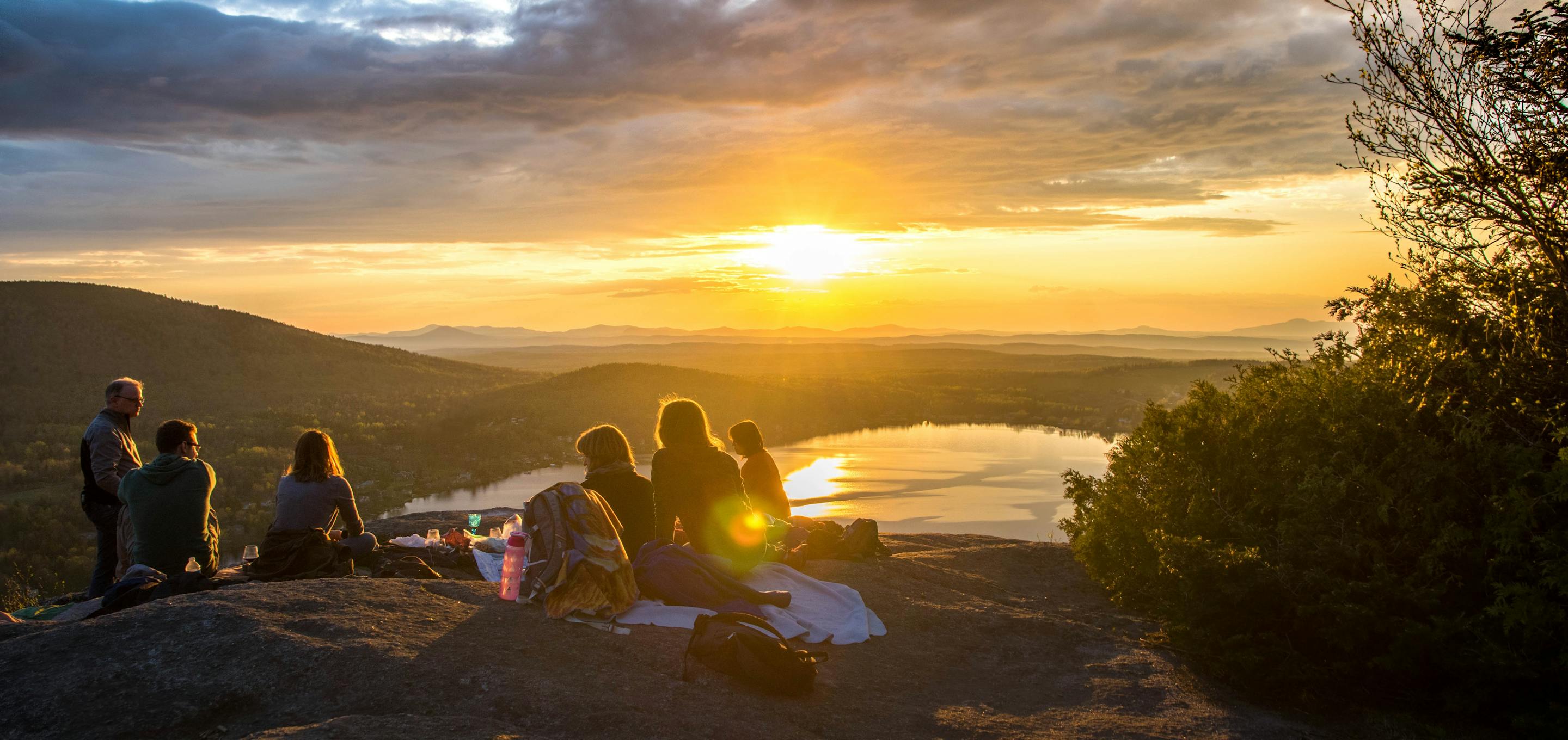 People in landscape at sunset