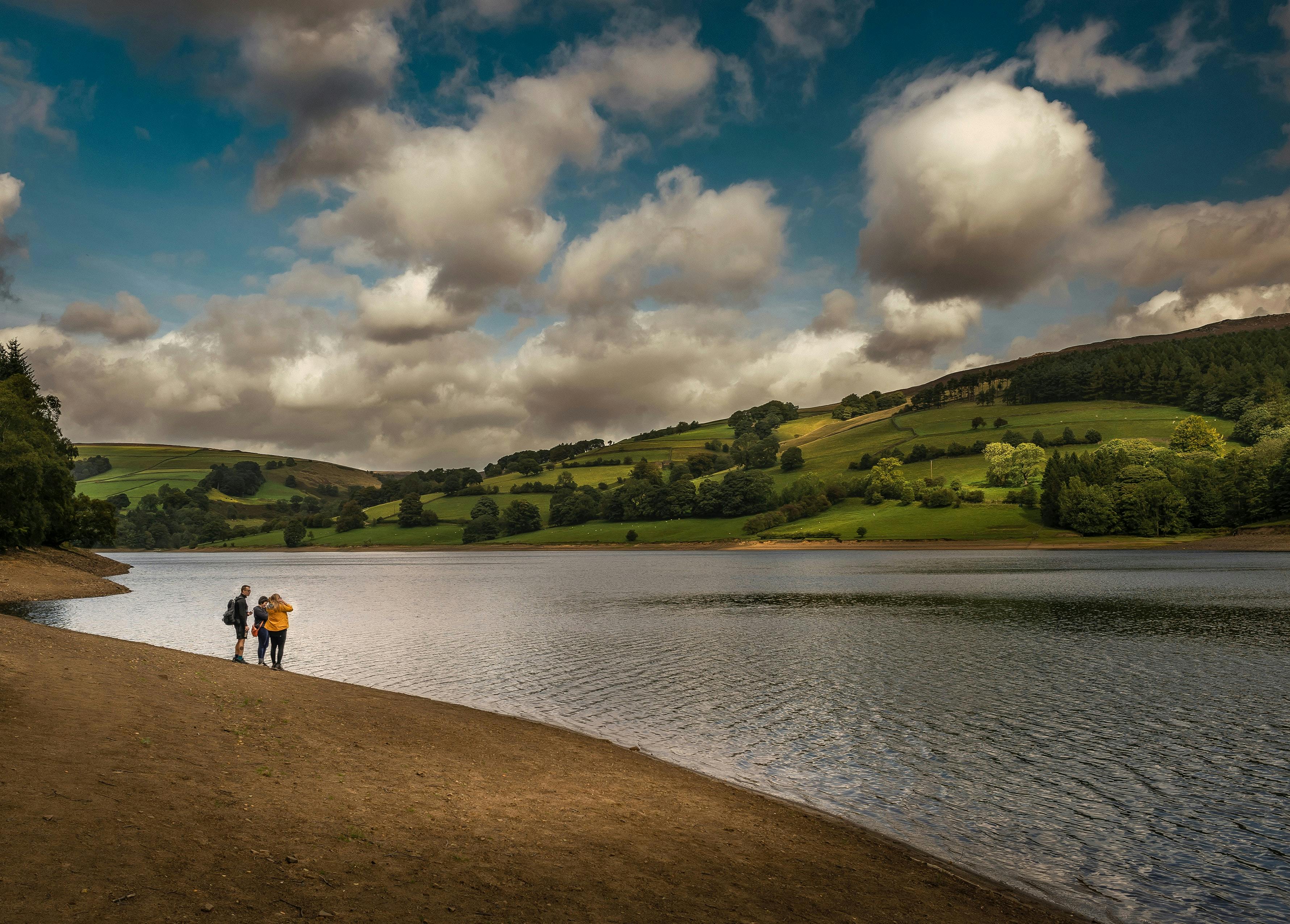 lake and hills over landscape with people