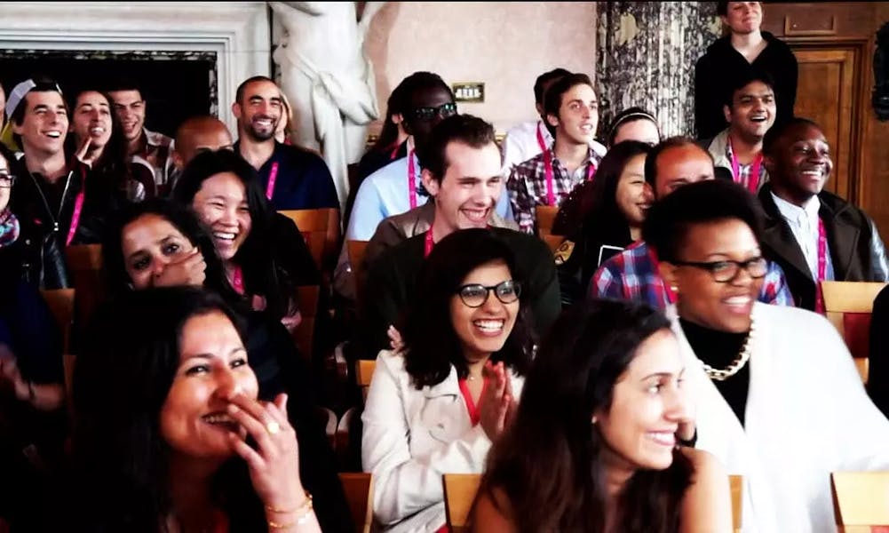 An audience watching a seminar