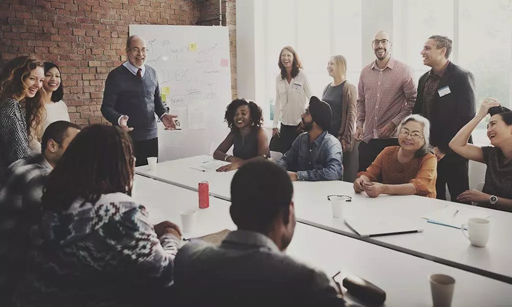 Brainstorming ideas in the office with a whiteboard and post it notes