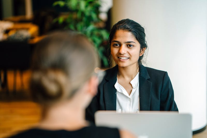 Young woman sits in an employee review