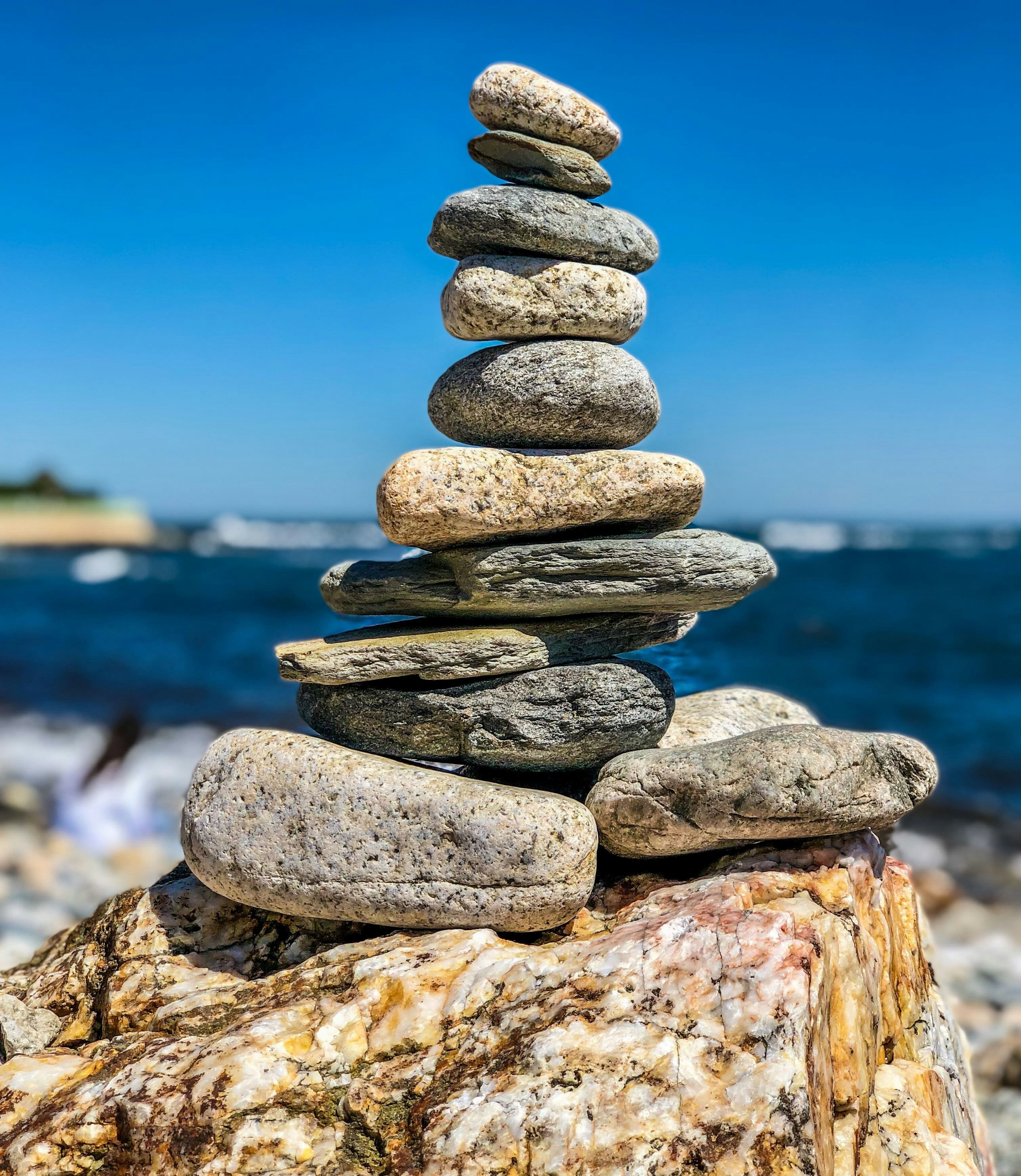 Stacked rocks beside the ocean