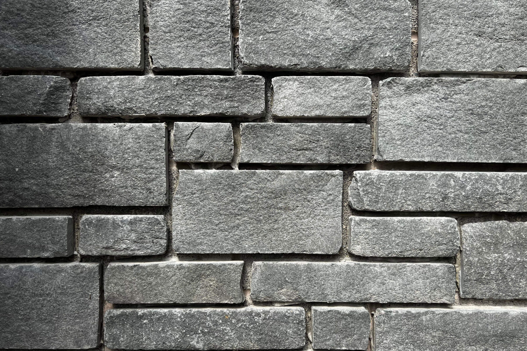 Grey green sandstone is quarried in the UK, and provides a mixture of greens, greys and occasional rustic buffs.  Blue Green Grey