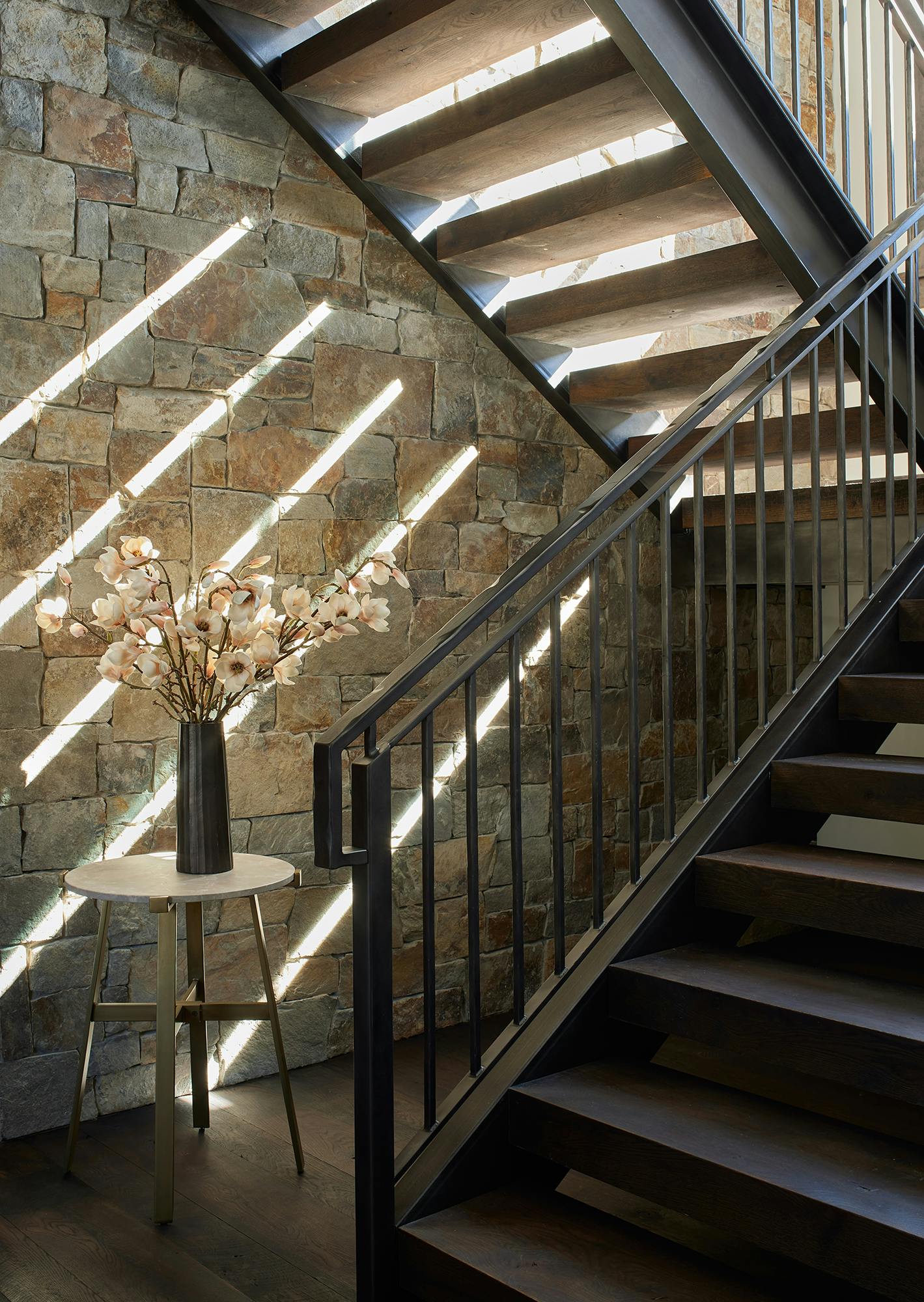Jackson Hole Interior Design vignette of staircase and stone accent wall