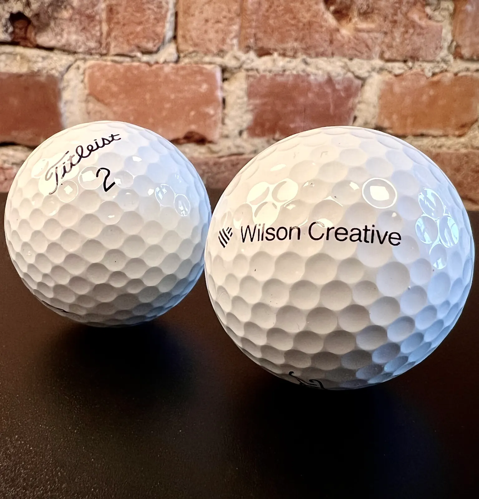 Titleist golfbollar med Wilson Creative-logo
