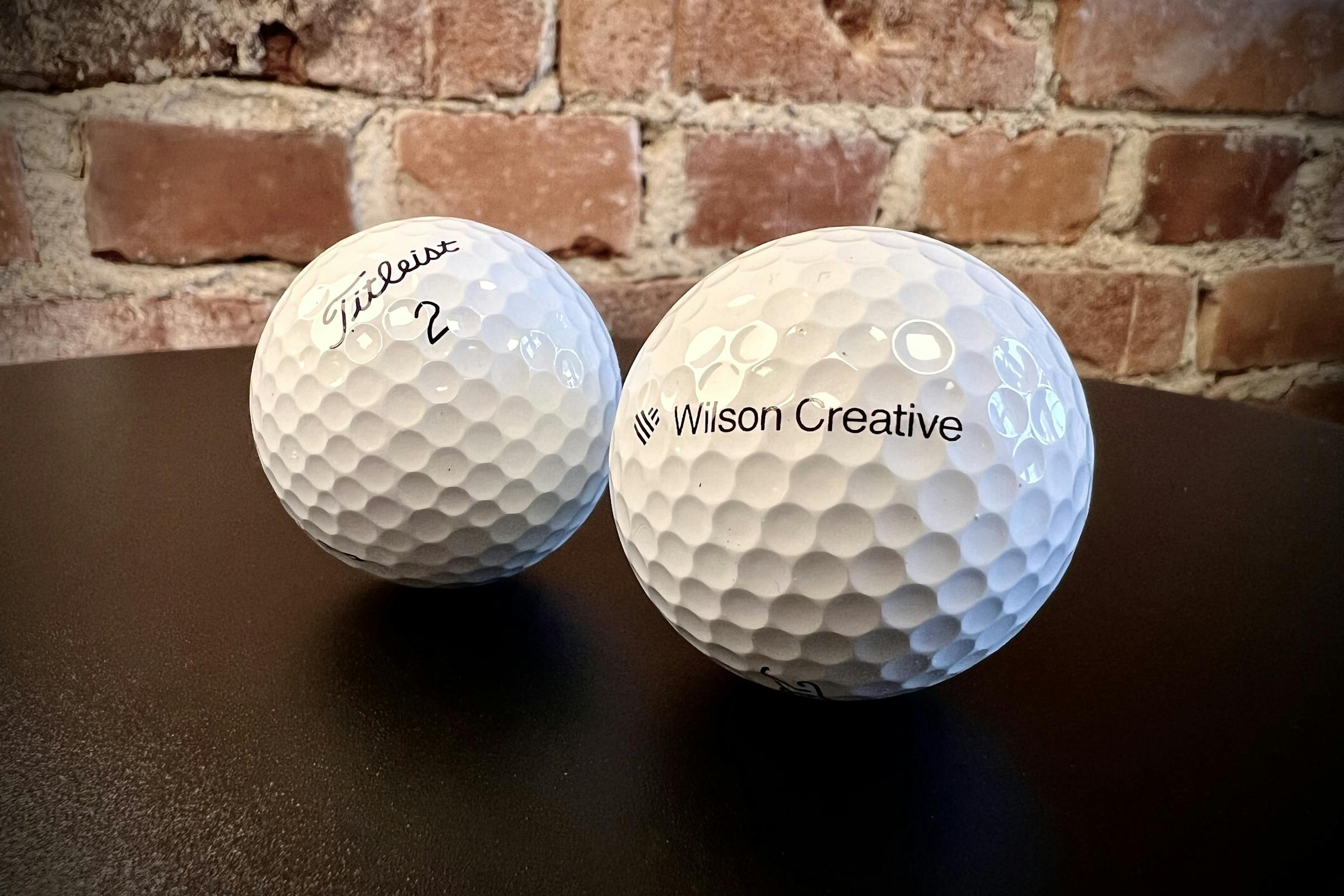 Titleist golfbollar med Wilson Creative-logo