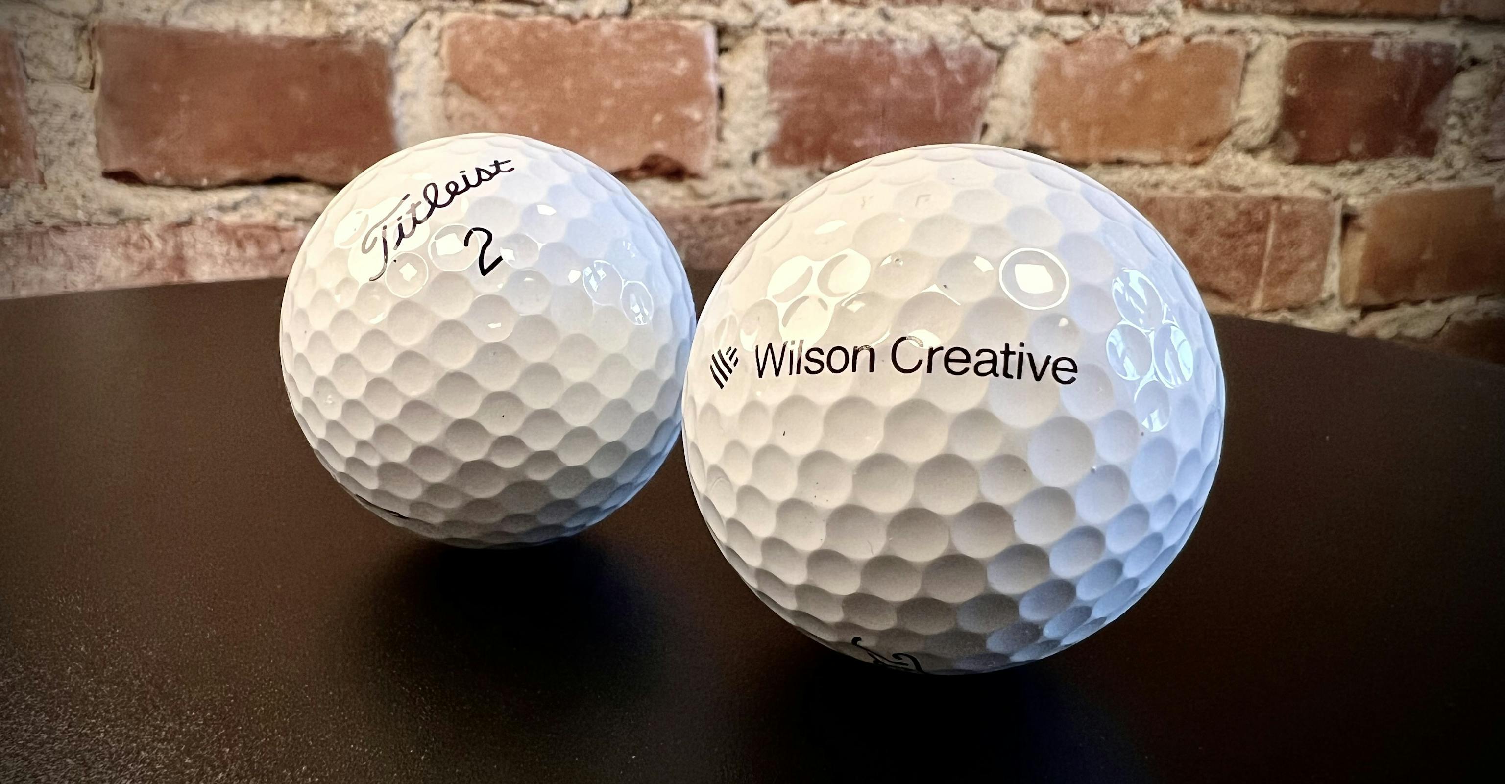 Titleist golfbollar med Wilson Creative-logo