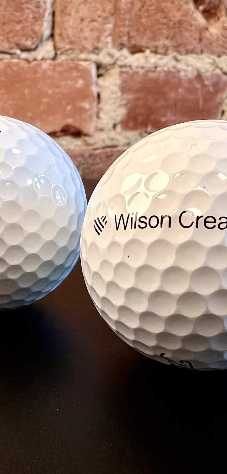 Titleist golfbollar med Wilson Creative-logo