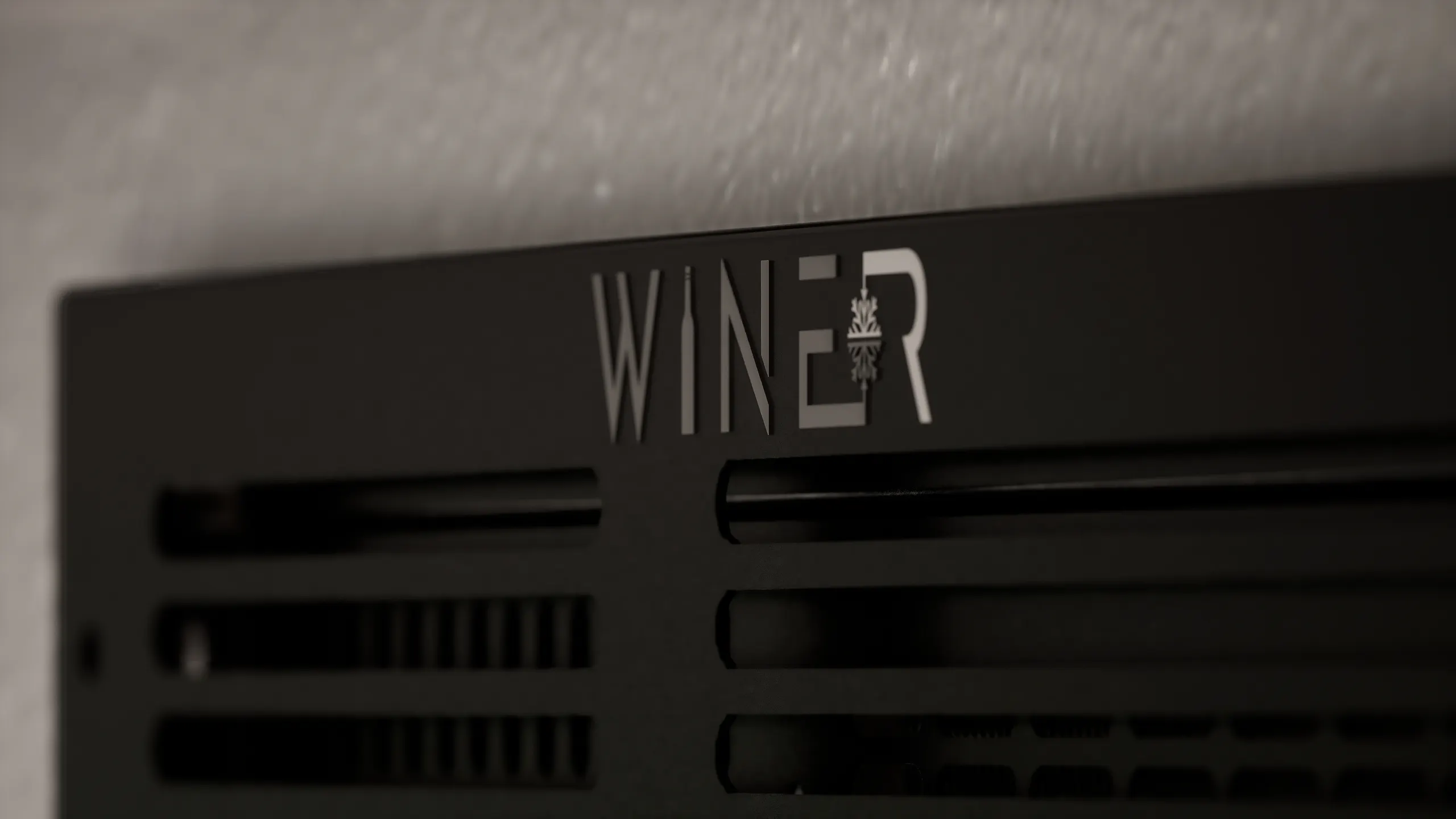 Close-up of the Wine-R unit grille with the Wine-R logo