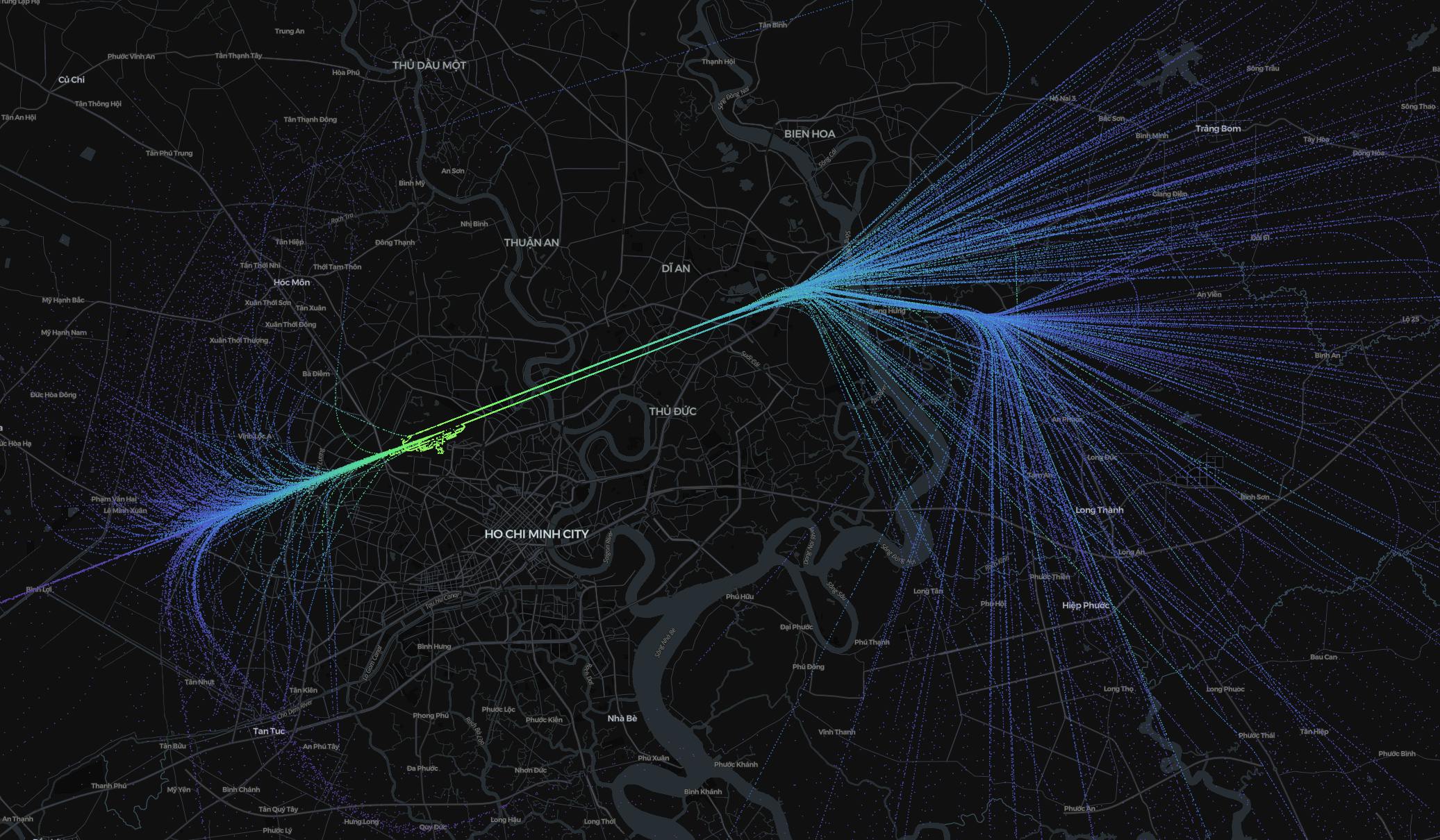 Image shows a dark map of Ho Chi Minh City, with hundreds of flight paths above it in a blue to green gradient, representing the altitude.