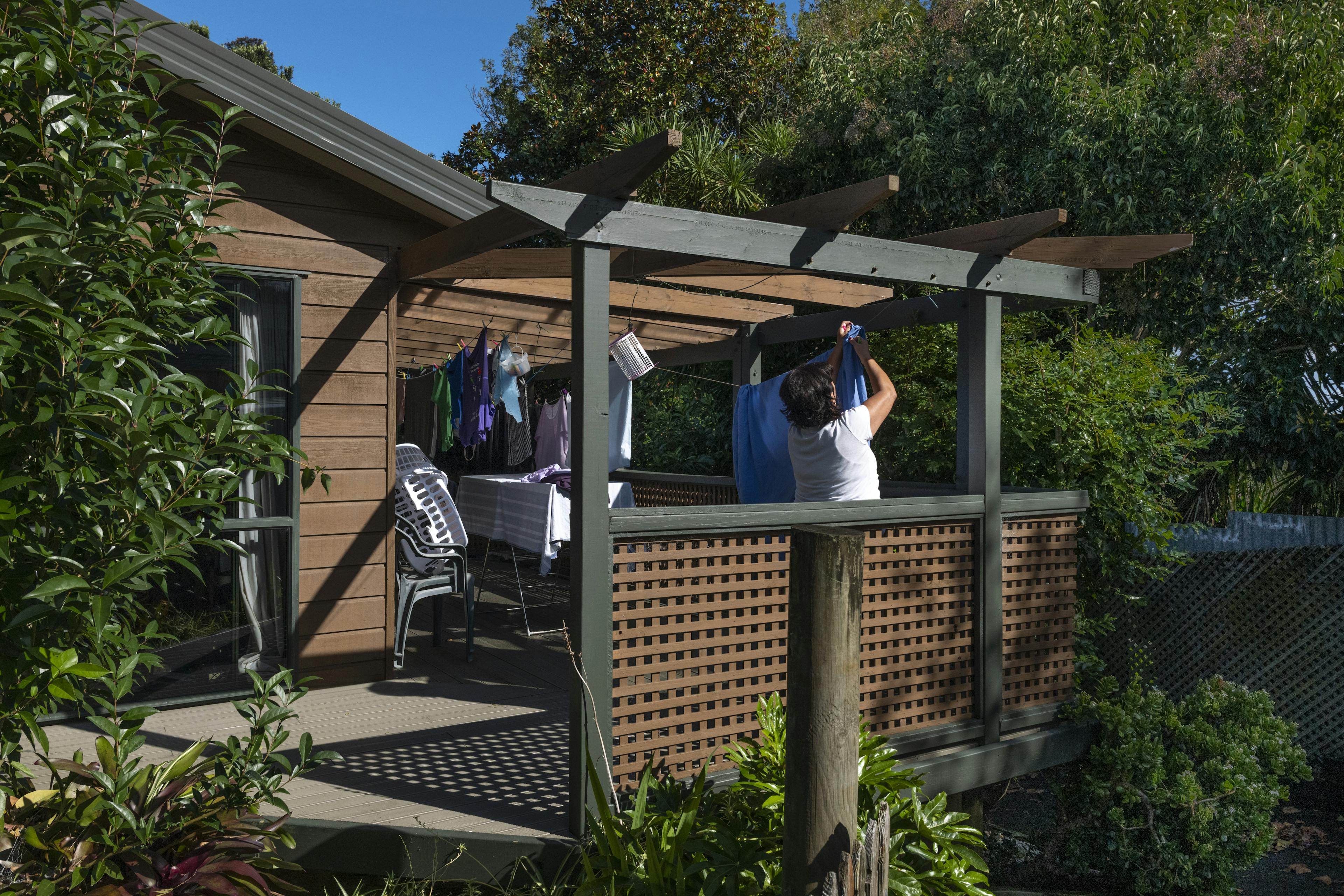 Wings Trust member putting up washing & laundry