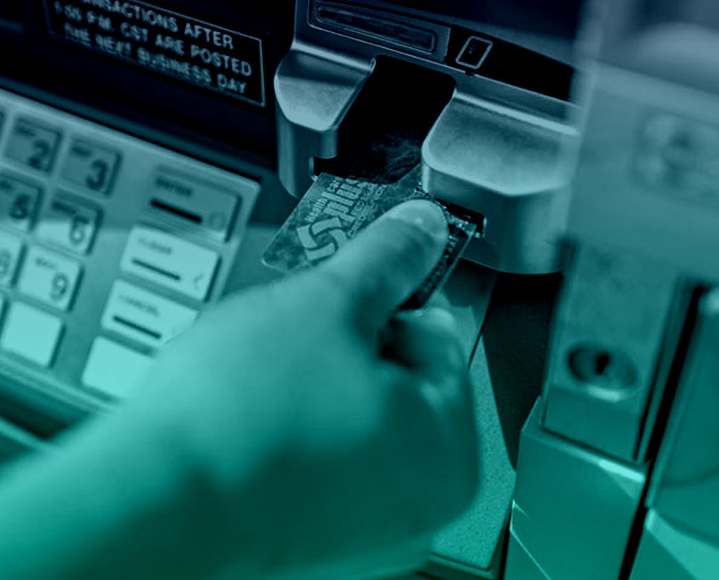 Hand at ATM with card