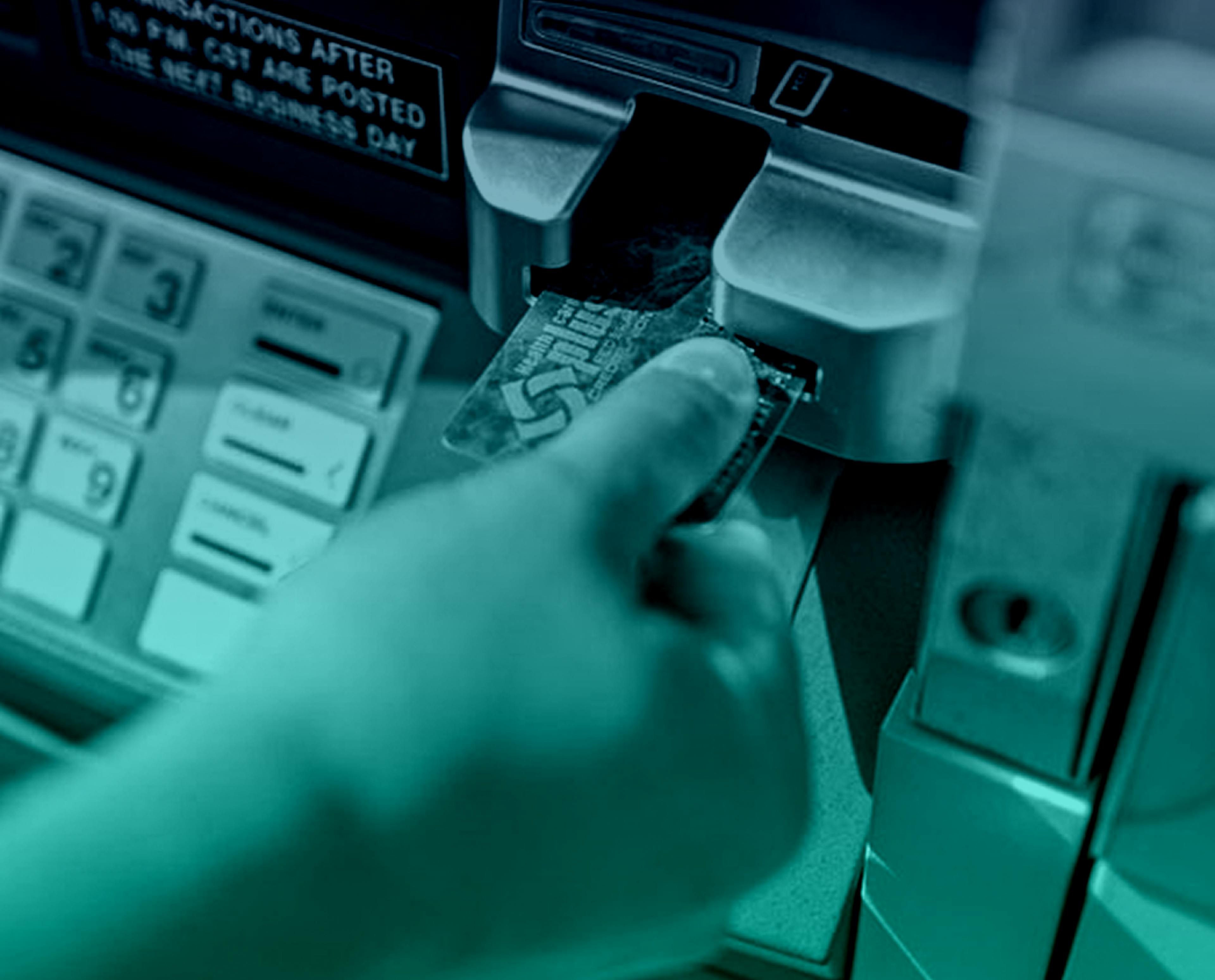 Hand at ATM with card