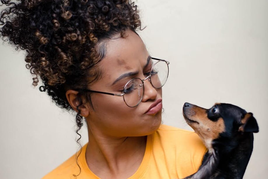 Woman looking at her shelter dog