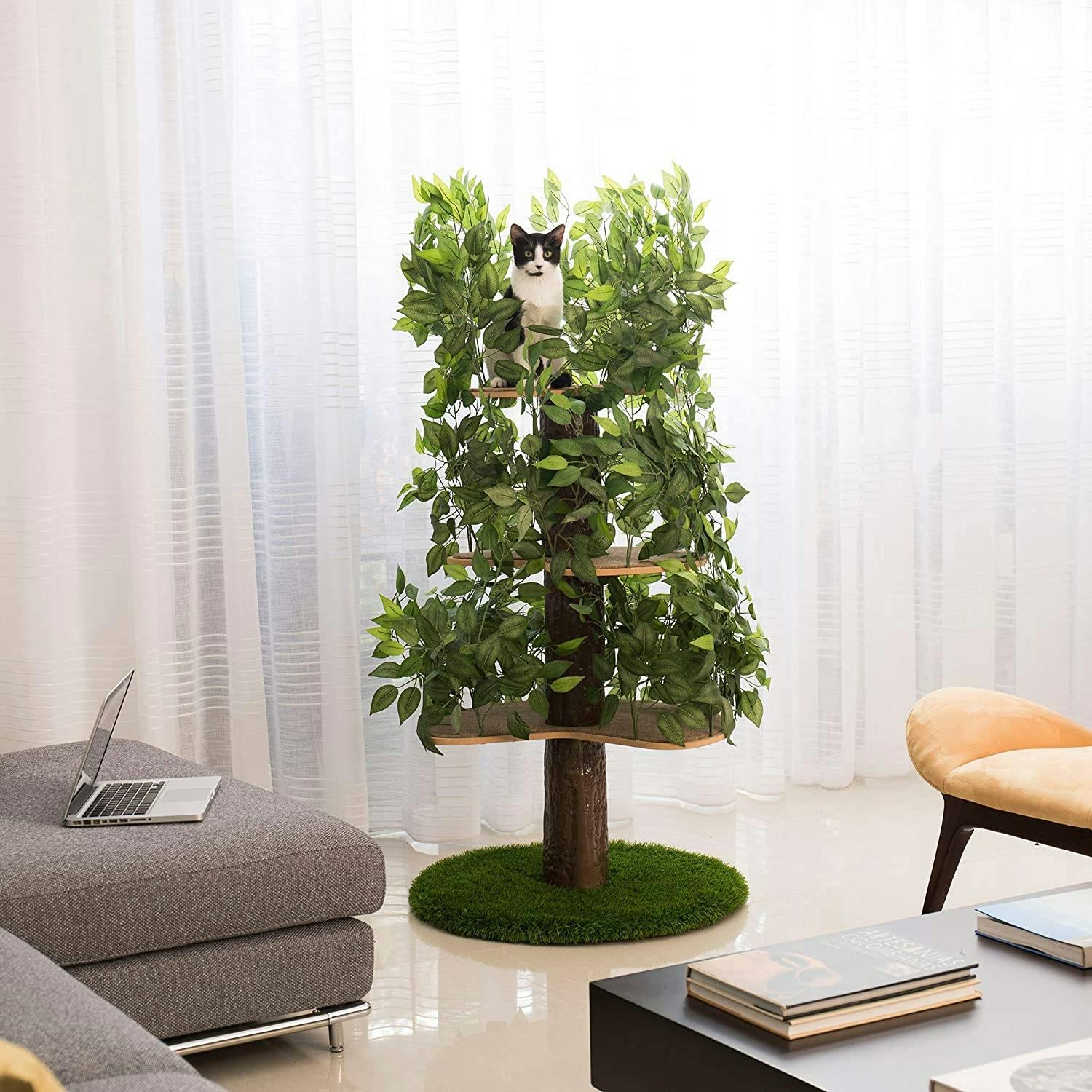 Cat on top of a cat tree designed to look like a tree