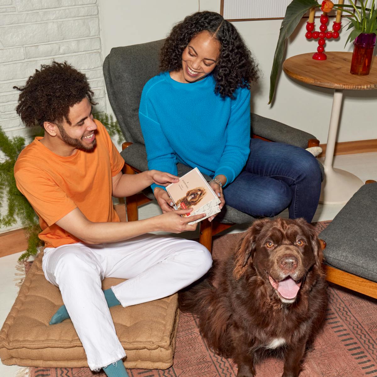 A woman gives a Wisdom Panel pet DNA test as a gift to her partner