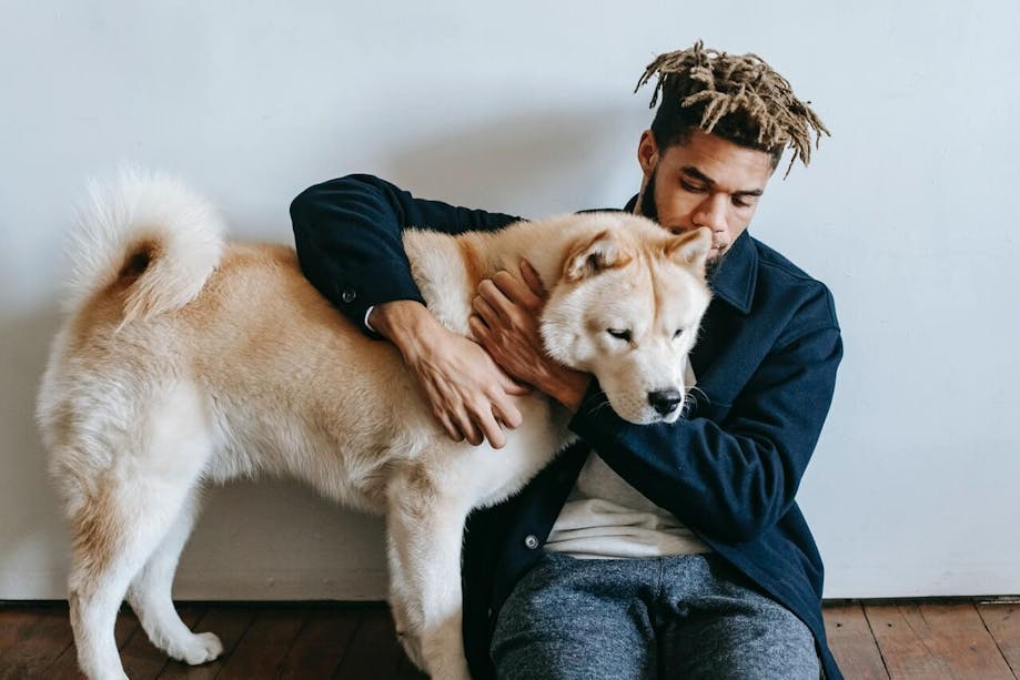 Man hugging his ESA dog