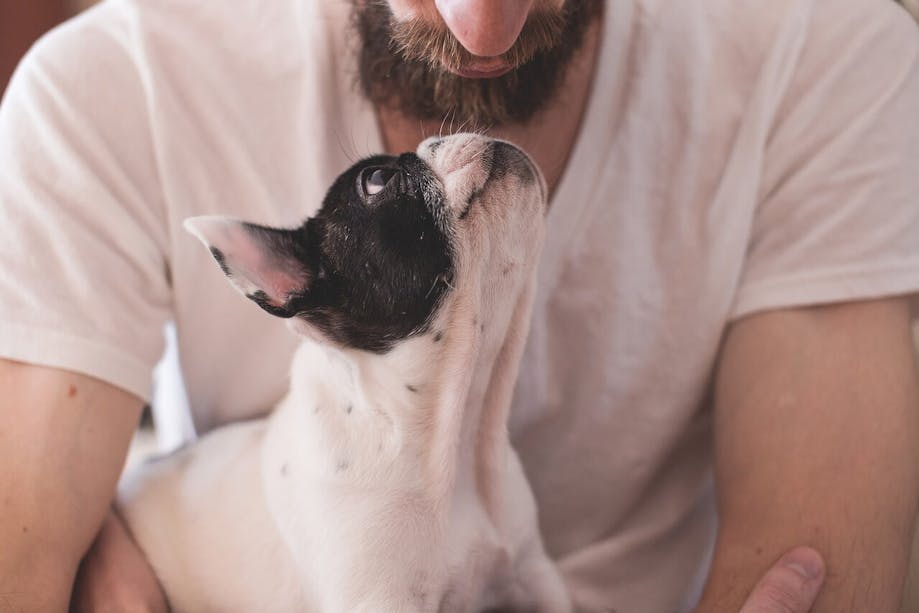 Man holding dog