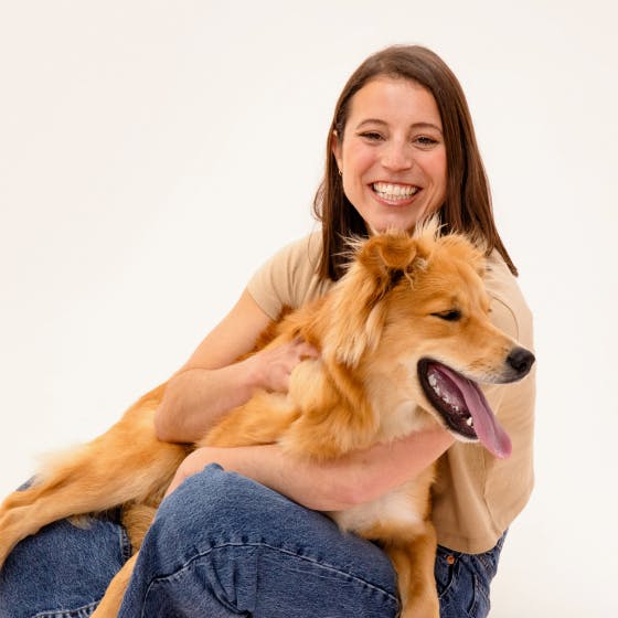 A Lady holding a dog