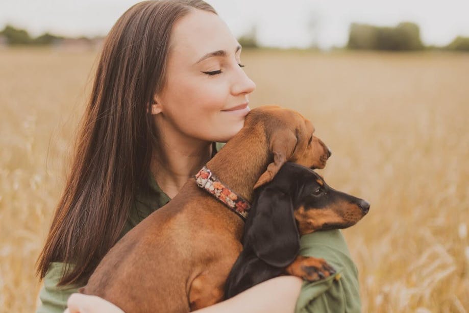 Woman getting emotional support from her dogs