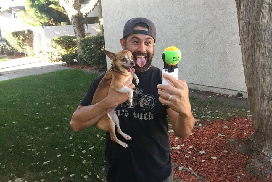 Man taking a selfie with his Chihuahua