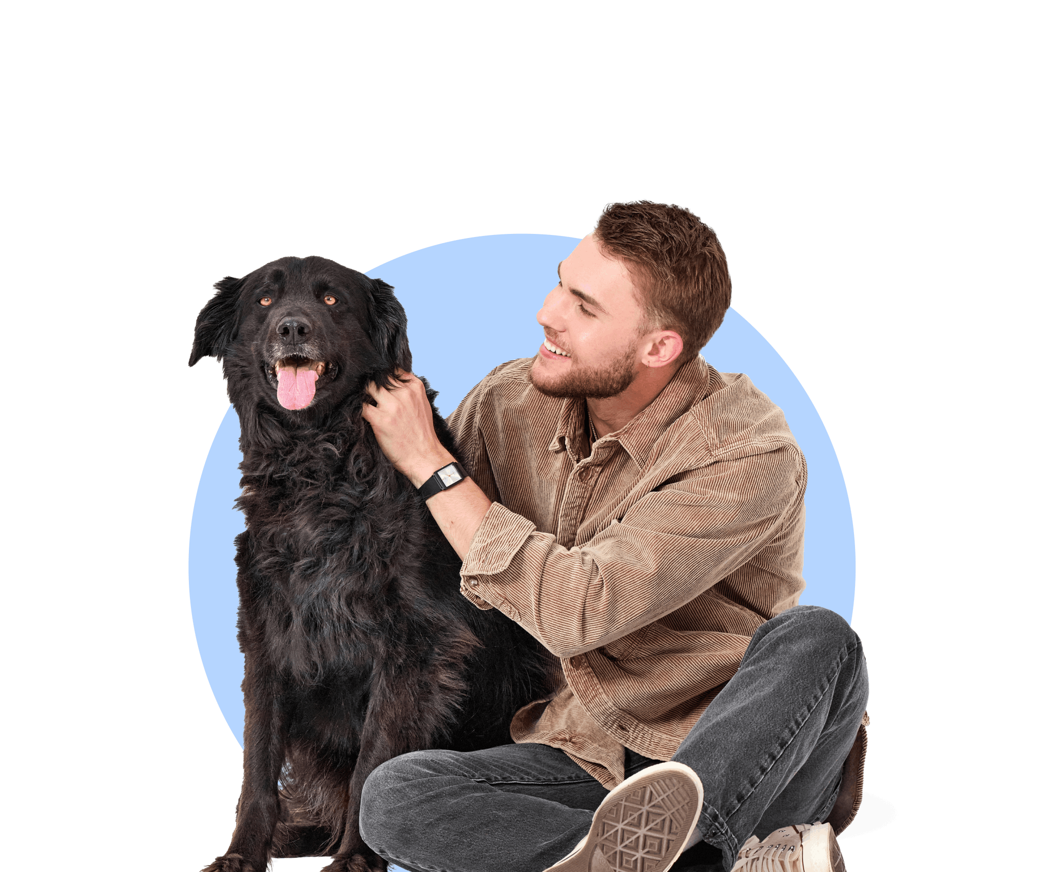 Young pet parent dad hugging his mixed breed happy black dog with tongue out
