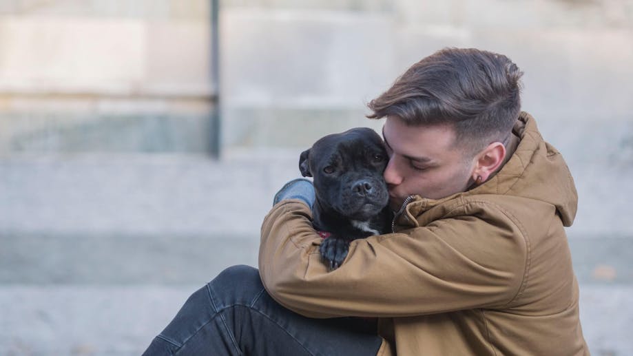 Man hugging his dog