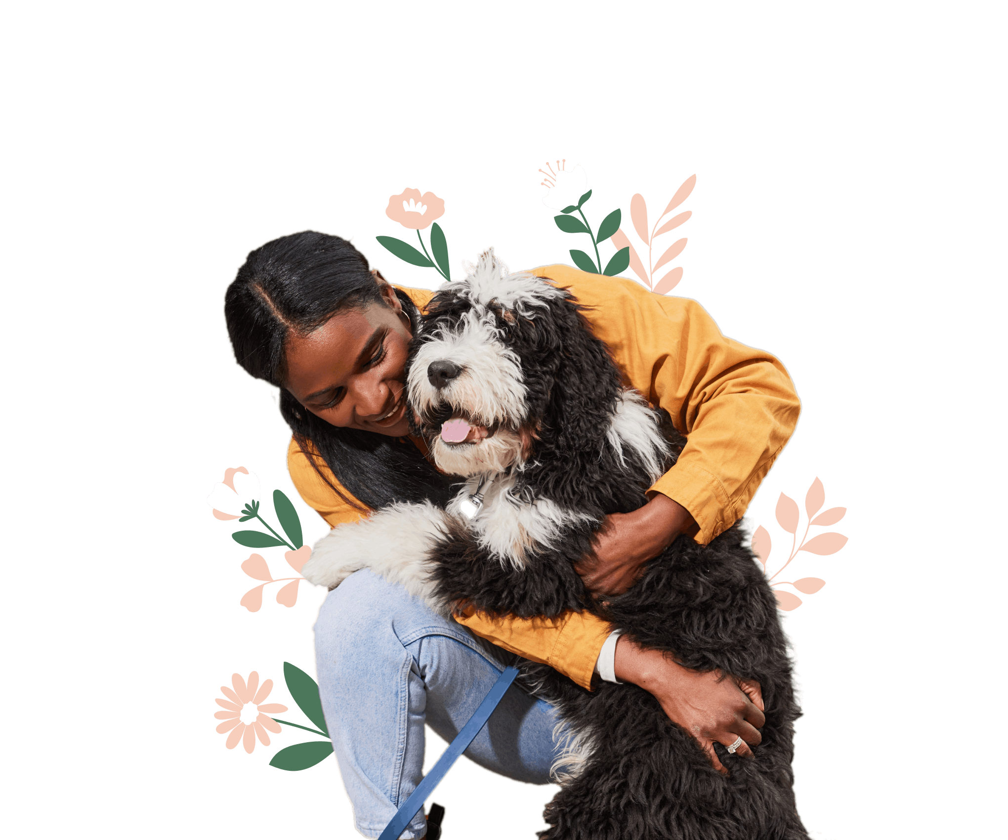 Young woman hugging playful black and white shaggy mixed breed dog