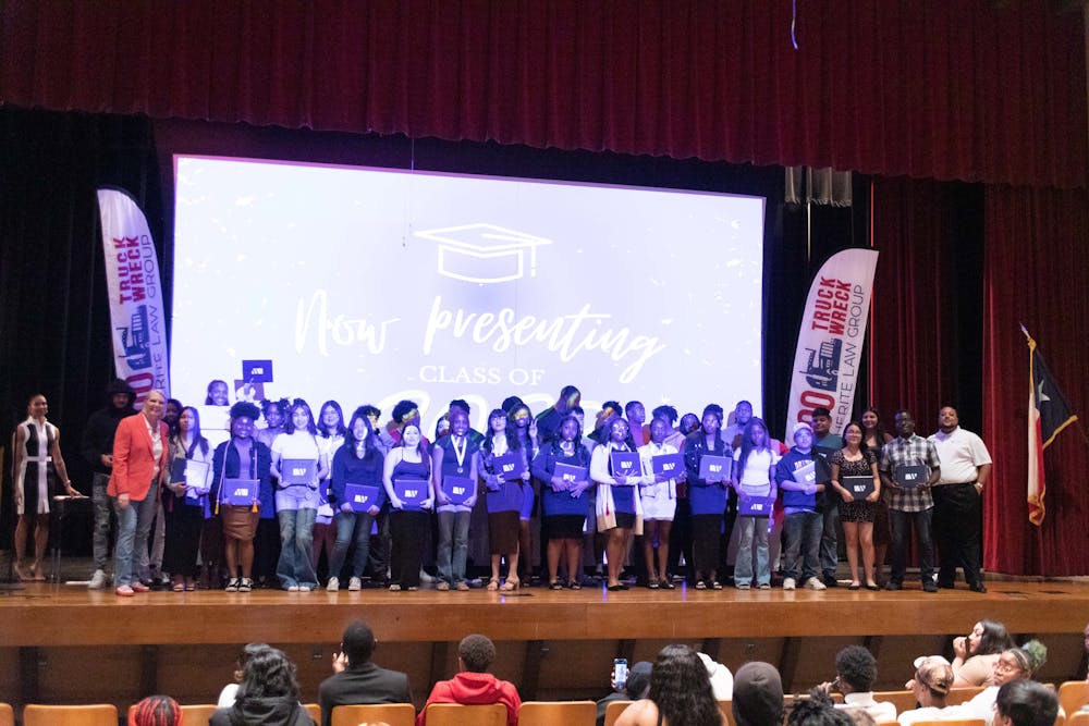 The Witherite Law Group surprises 44 Dunbar High School seniors with scholarships