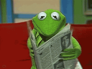 Kermit reading a newspaper
