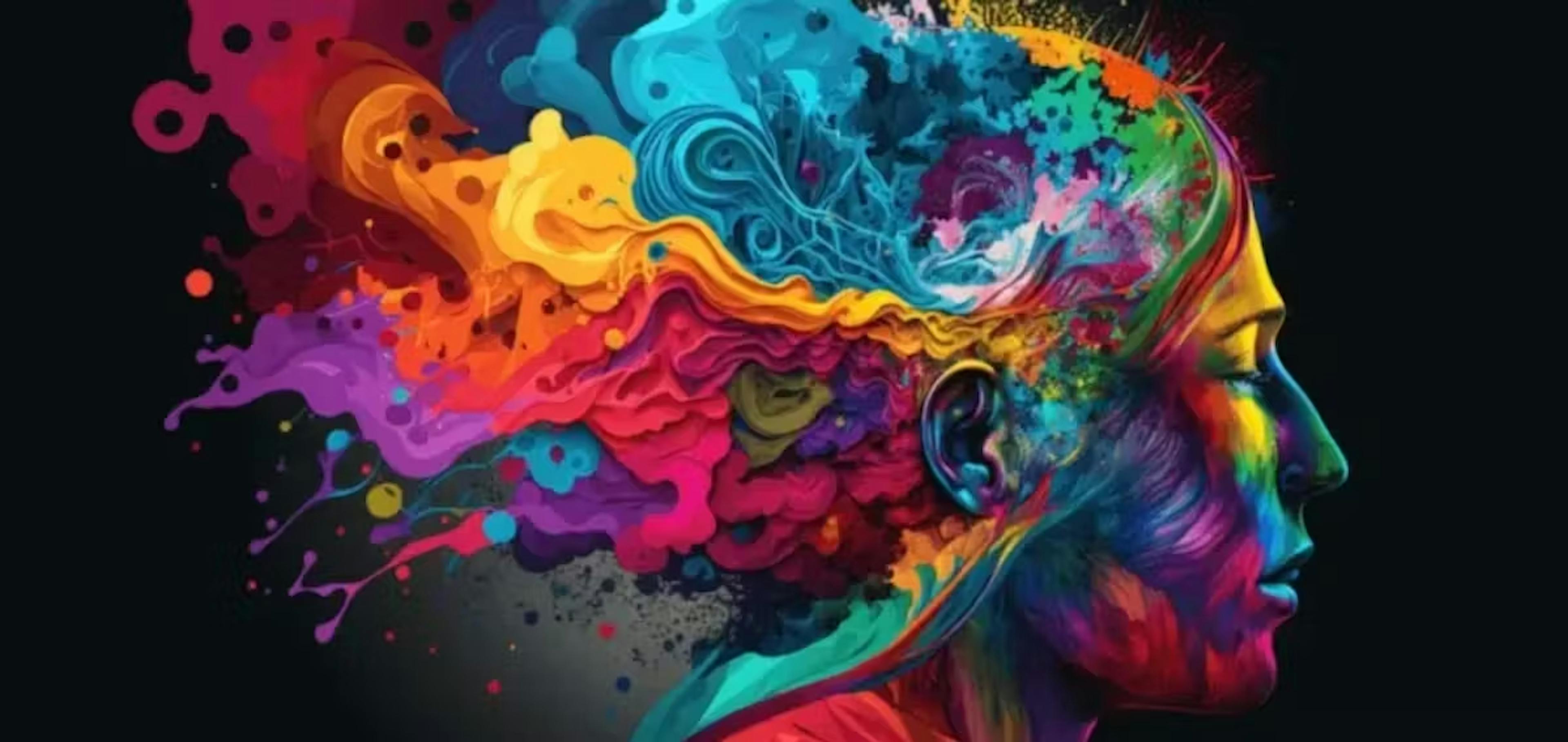 A vibrant profile of a human head with colorful, fluid paint splashing outward from the brain area. This artistic representation explores colors psychology in design by using a full spectrum of hues to symbolize creativity, diverse thought, and emotional depth.