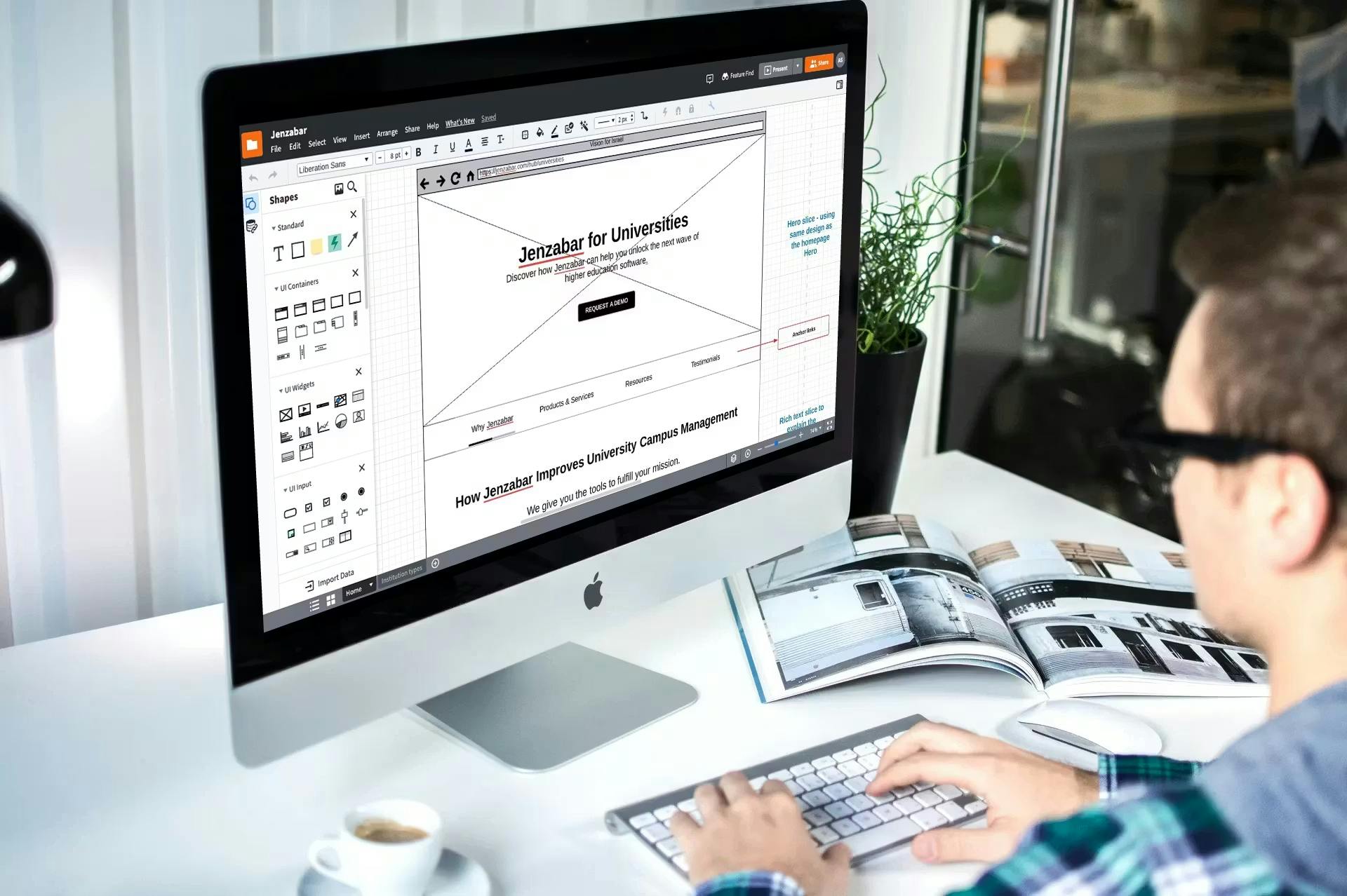 A web designer working on a wireframe at a clean desk, showcasing the professional tools used in how to build a custom website.