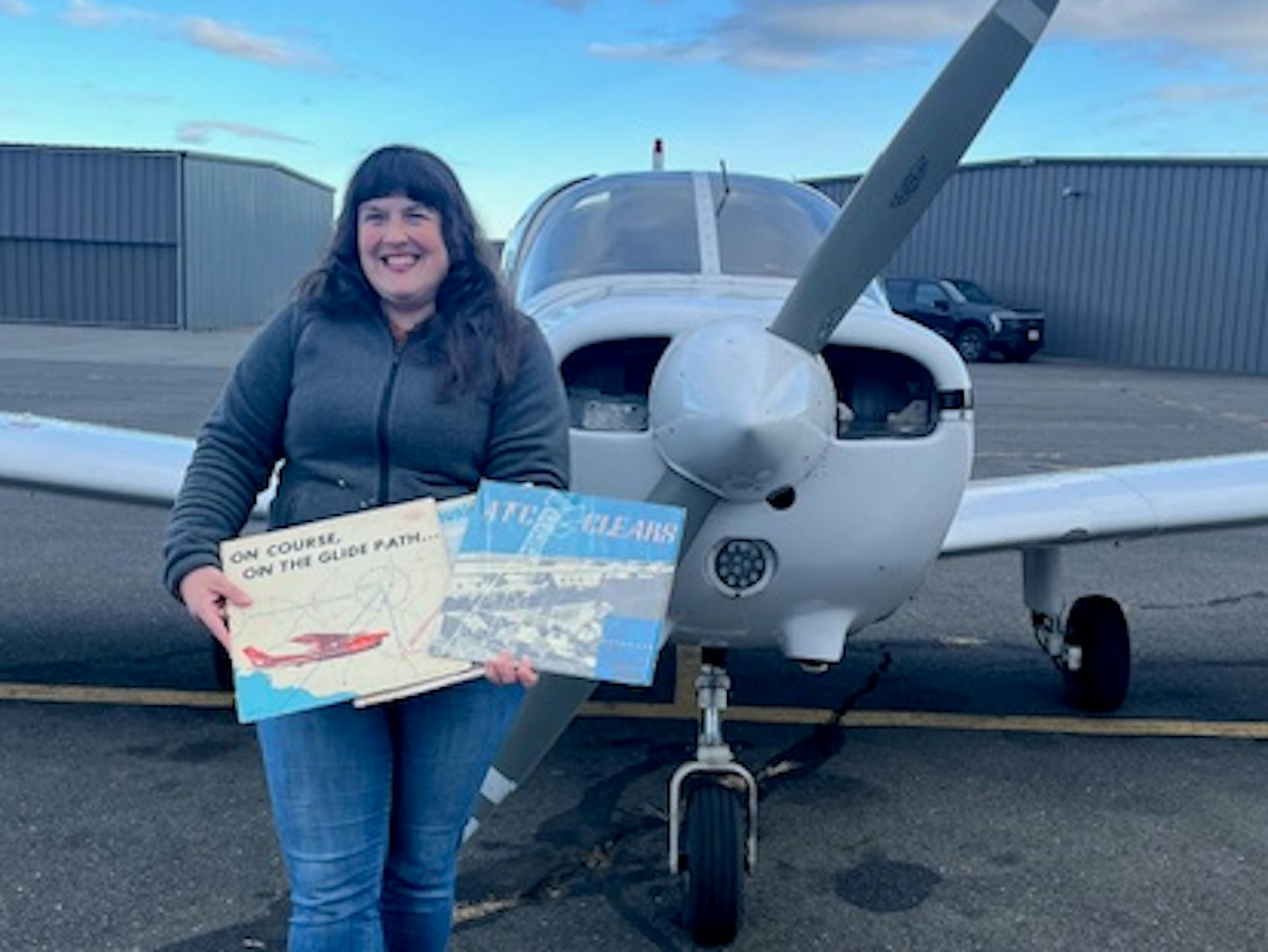 Emily Lyon Portrait in Front of Plane