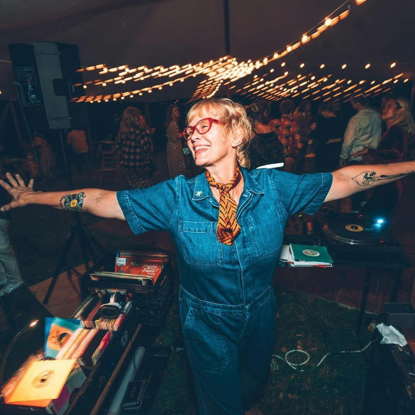 Kitty joyful posing with records
