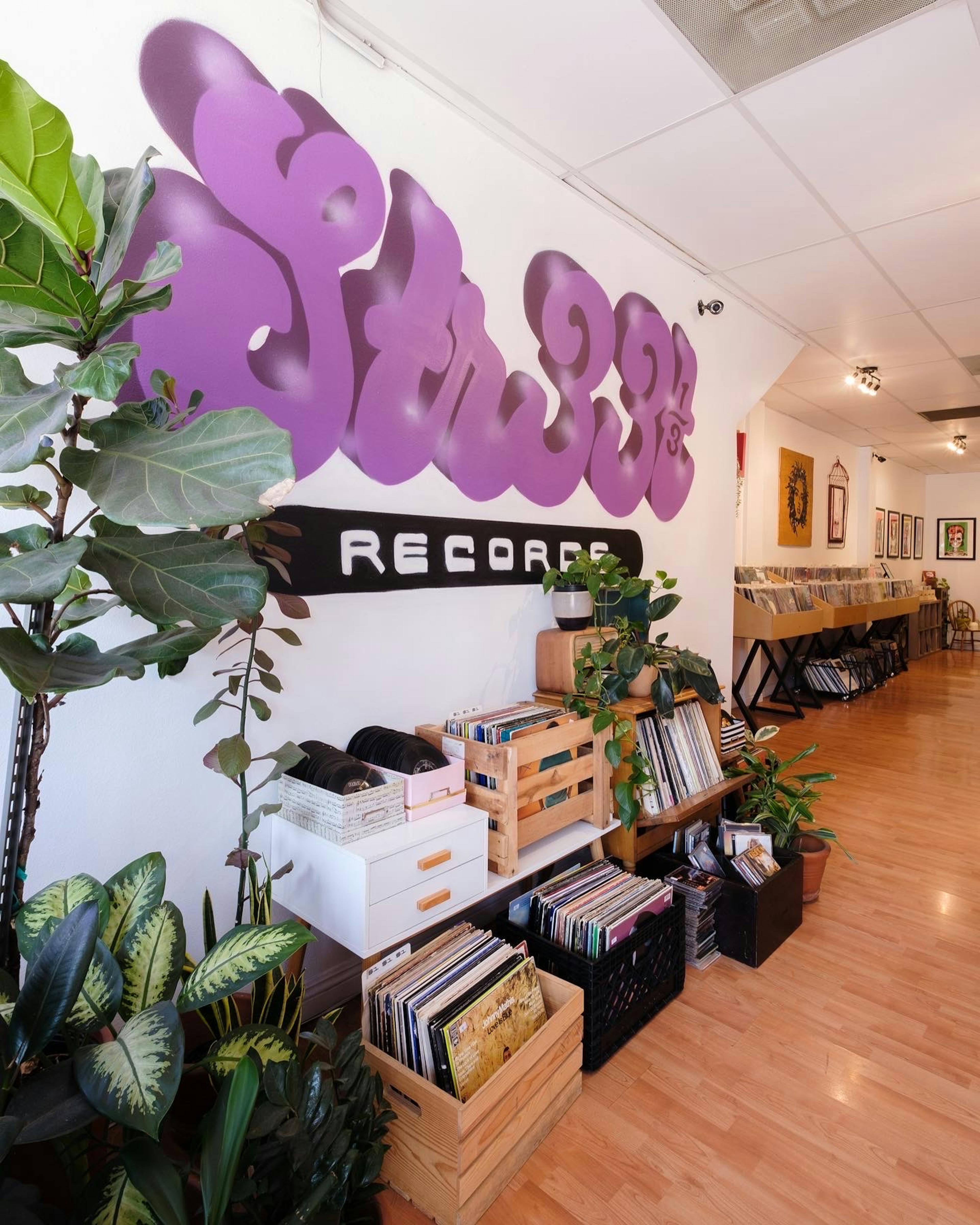 Portrait of the record store and logo wall