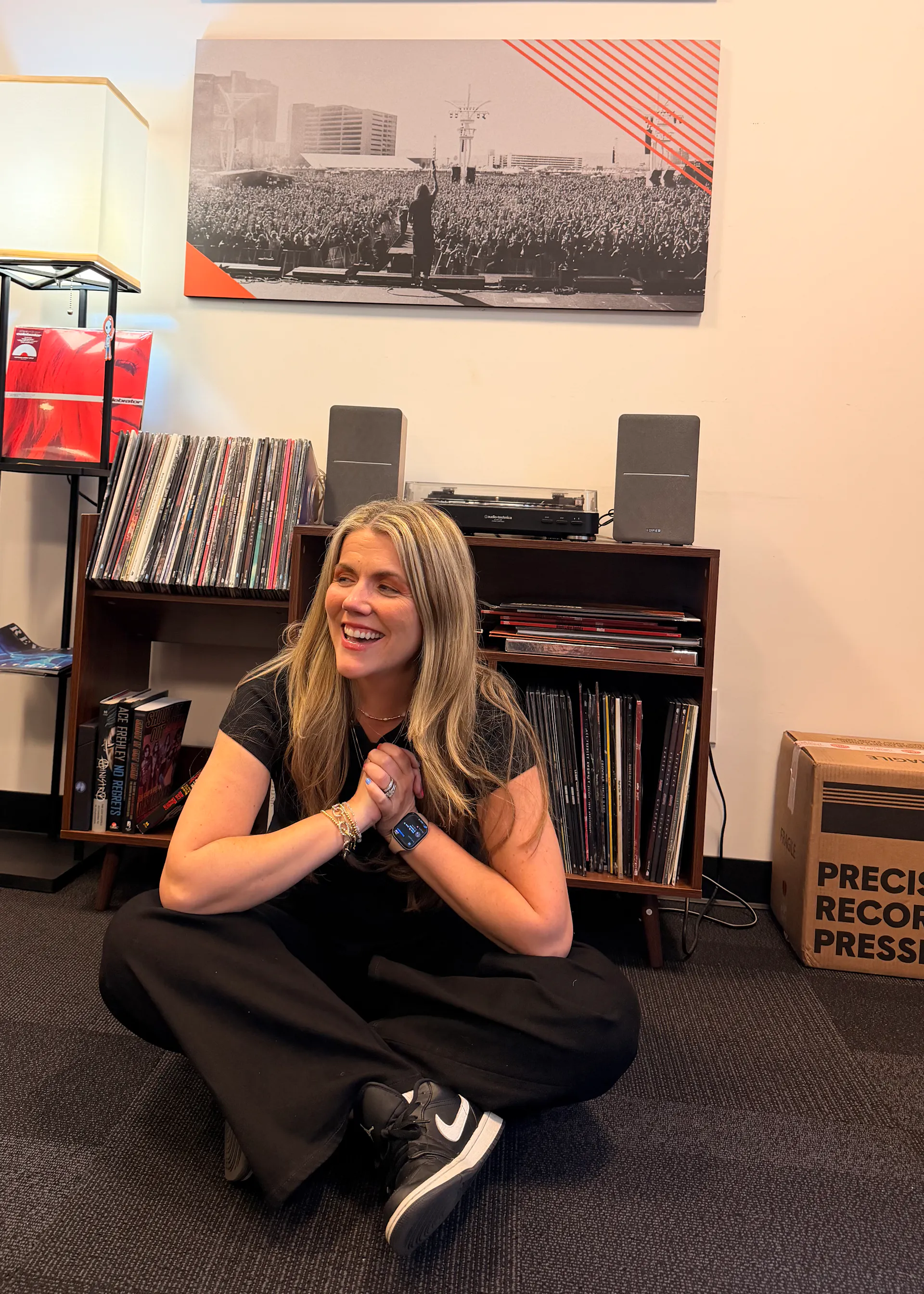 Portrait of Jen sitting on floor with records