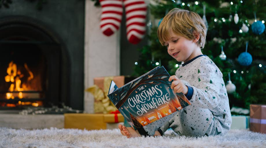 boy reading Christmas Snowflake