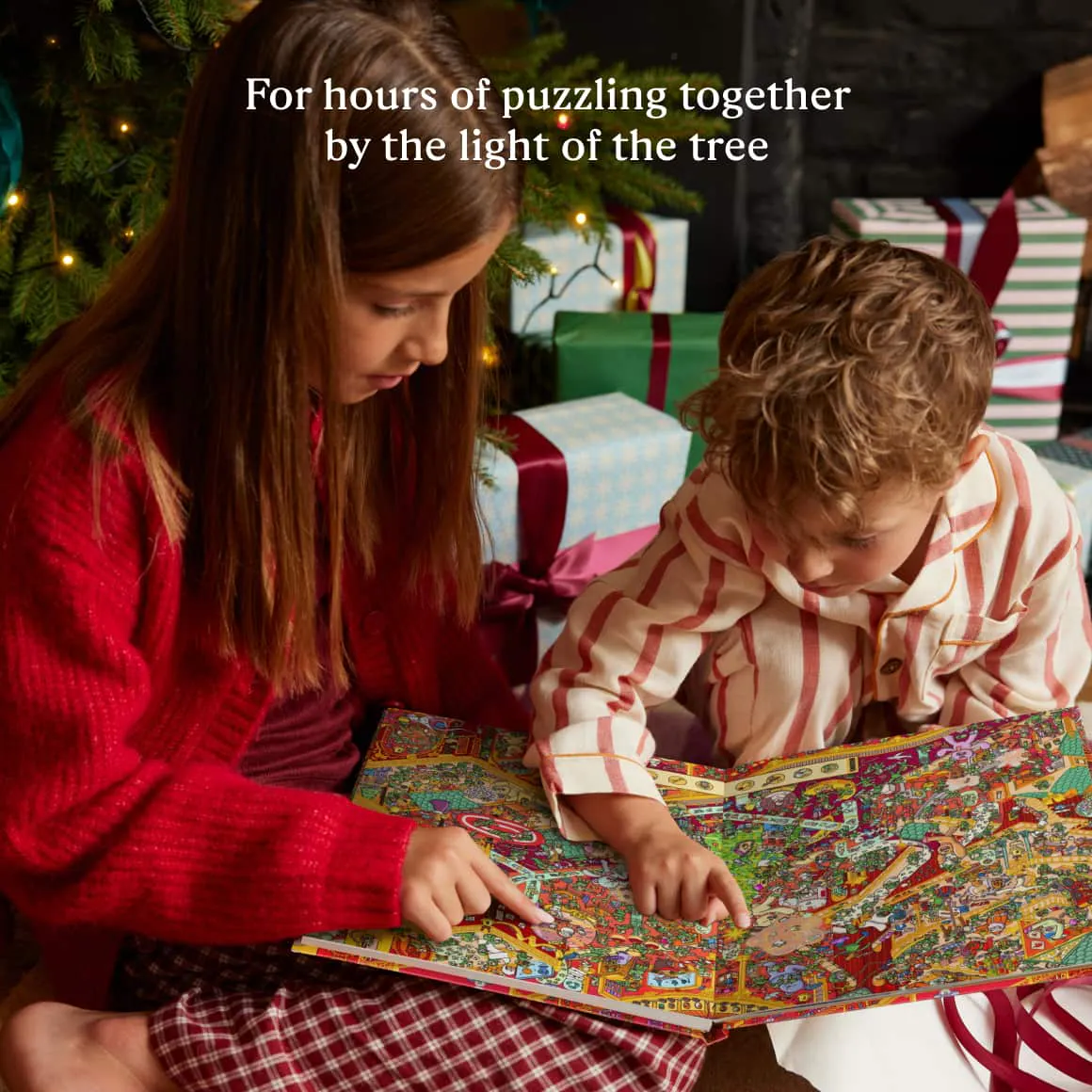 kids reading book by the tree