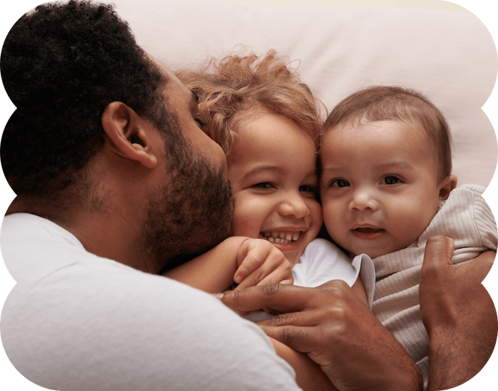 dad and kids hugging