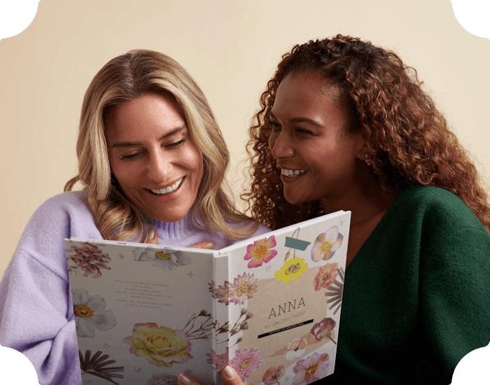 Two friends reading the personalised book together
