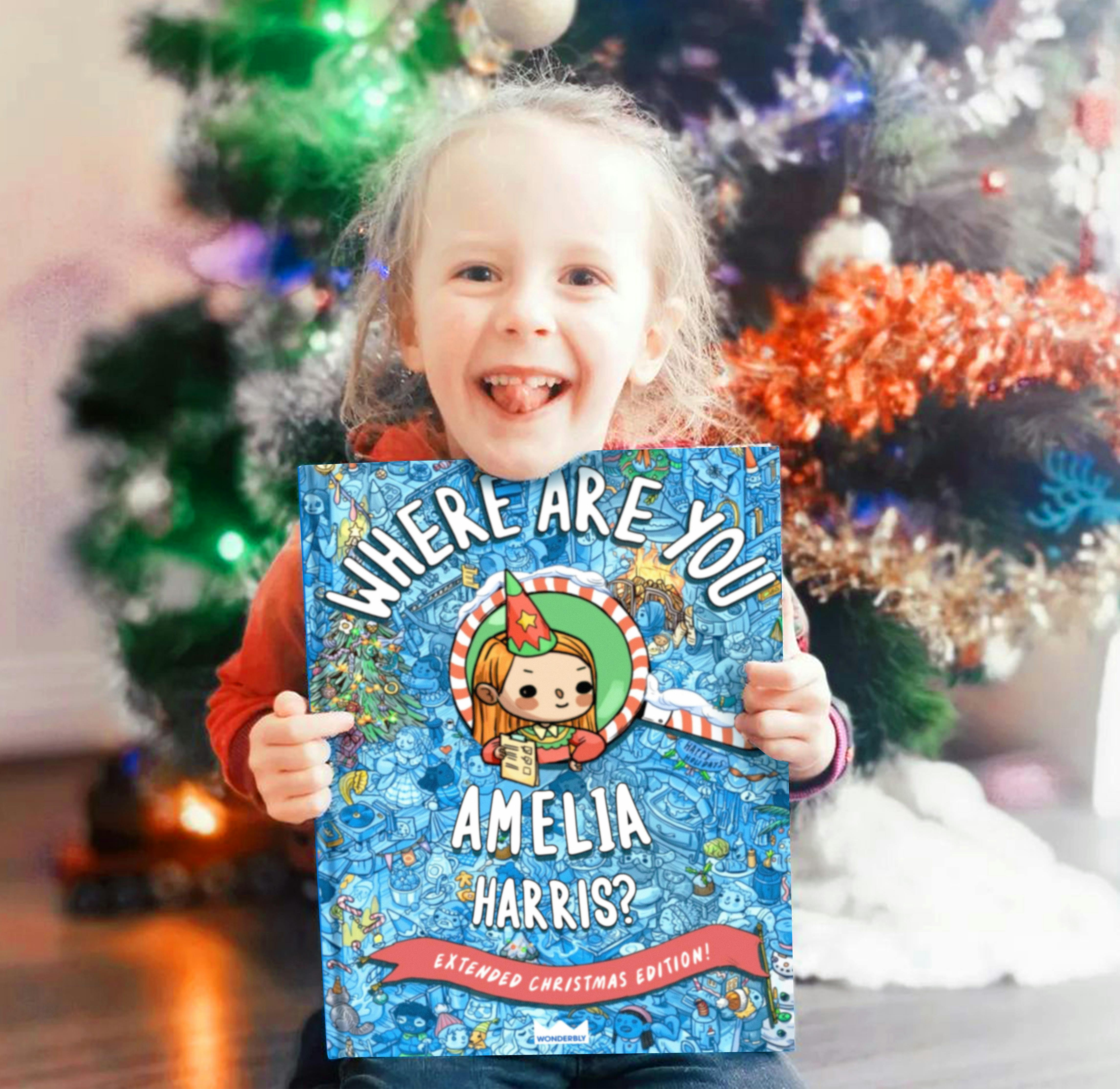 Girl holding personalized christmas book