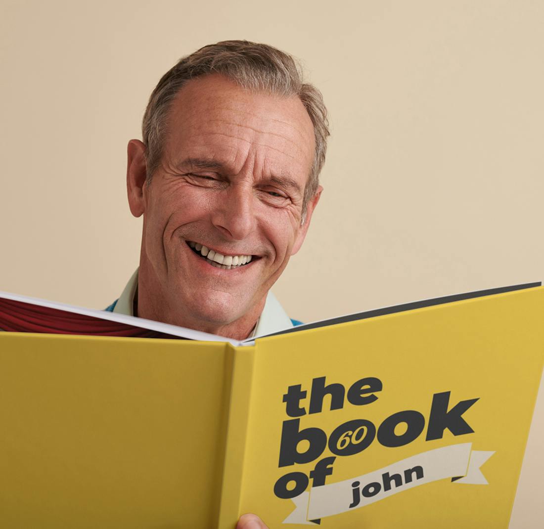 Man holding his personalized book