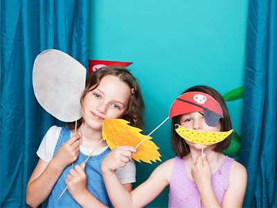 kids playing dress up with props