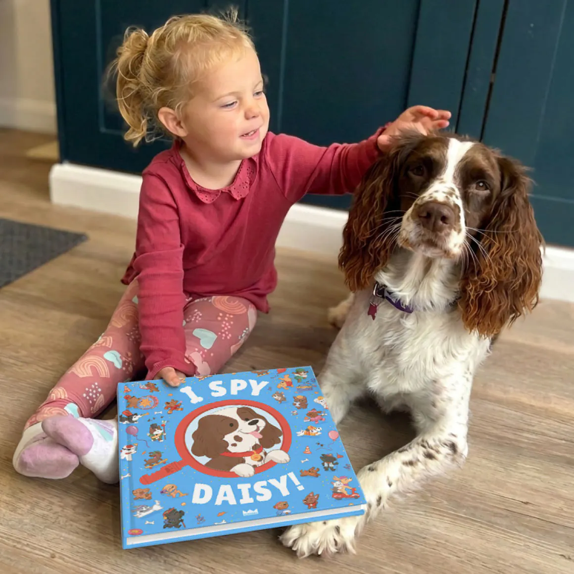 kid petting dog with the personalised book