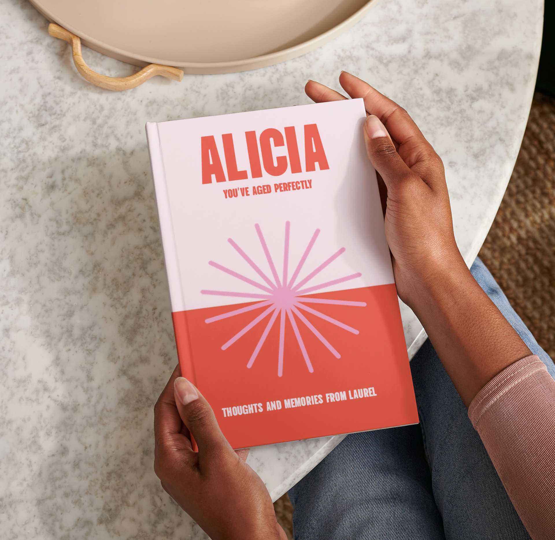 Two hands holding the personalised book