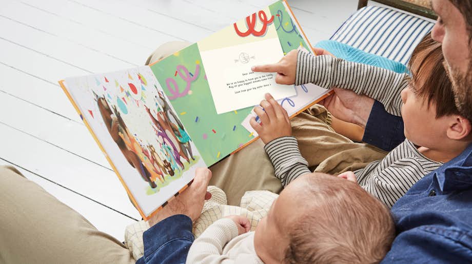 Image of family enjoying the littlest bear book.